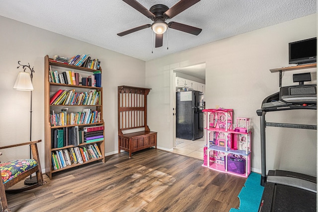 1826 Concho River Ct, Sugar Land, TX 77478 - recreation room featuring wood finished floors, ceiling fan, a textured ceiling, and baseboards