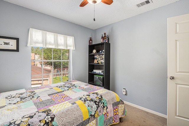 1826 Concho River Ct, Sugar Land, TX 77478 - carpeted bedroom featuring baseboards, a ceiling fan, and a textured ceiling
