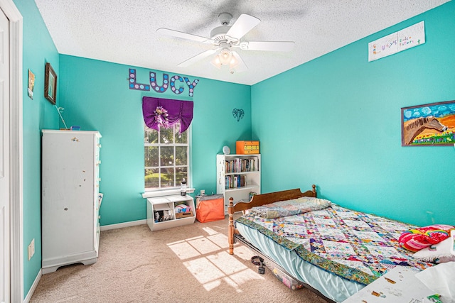 1826 Concho River Ct, Sugar Land, TX 77478 - carpeted bedroom featuring a textured ceiling, baseboards, and a ceiling fan