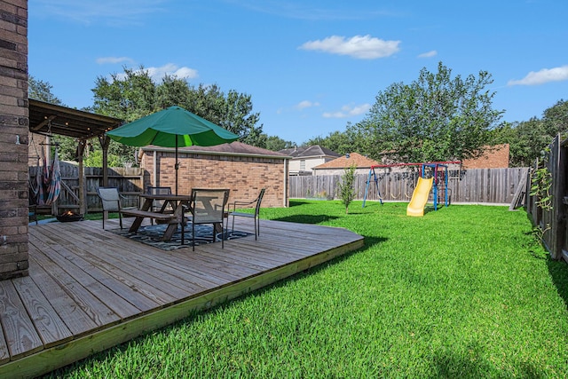 1826 Concho River Ct, Sugar Land, TX 77478 - view of yard featuring outdoor dining space, a deck, and a playground