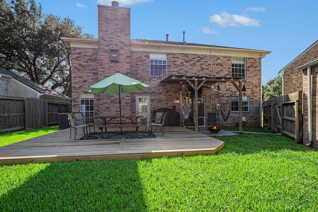 1826 Concho River Ct, Sugar Land, TX 77478 - back of house featuring a chimney, brick siding, and a wooden deck