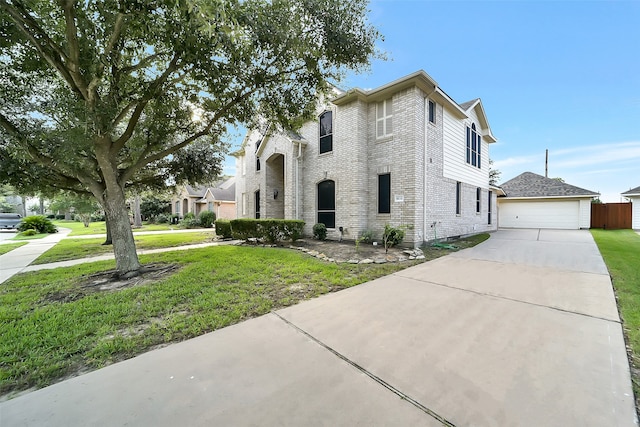 9215 Shango Ln, Houston, TX 77095 - traditional-style house with brick siding, a front lawn, and an outdoor structure