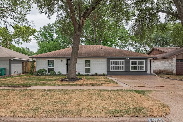 6023 Viking Dr, Houston, TX 77092 - ranch-style home with brick siding, a front yard, and a shingled roof