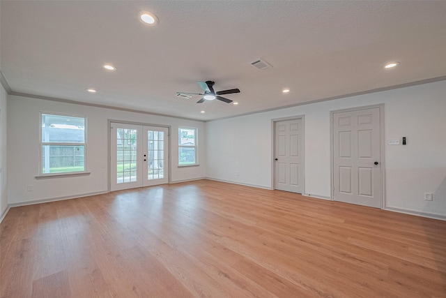 6023 Viking Dr, Houston, TX 77092 - spare room featuring baseboards, healthy amount of natural light, recessed lighting, ornamental molding, and light wood finished floors