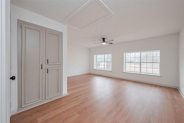 6023 Viking Dr, Houston, TX 77092 - spare room featuring attic access, light wood-style flooring, and baseboards