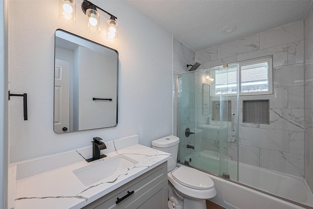 6023 Viking Dr, Houston, TX 77092 - bathroom with vanity, toilet, bath / shower combo with glass door, and a textured ceiling