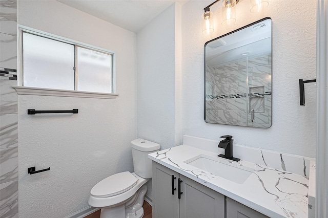6023 Viking Dr, Houston, TX 77092 - full bathroom featuring vanity, toilet, a shower, and a textured wall