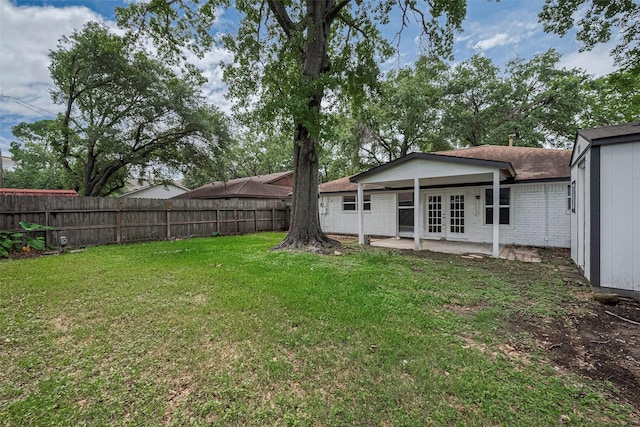 6023 Viking Dr, Houston, TX 77092 - view of yard with french doors and a patio area