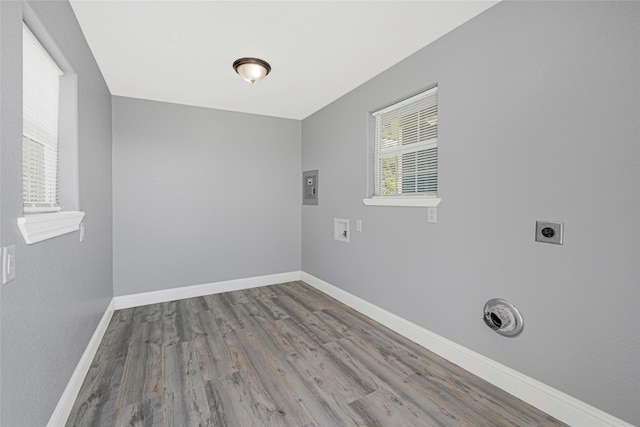 2406 W Elvinta St, Baytown, TX 77520 - laundry room with hookup for an electric dryer, washer hookup, wood finished floors, and baseboards