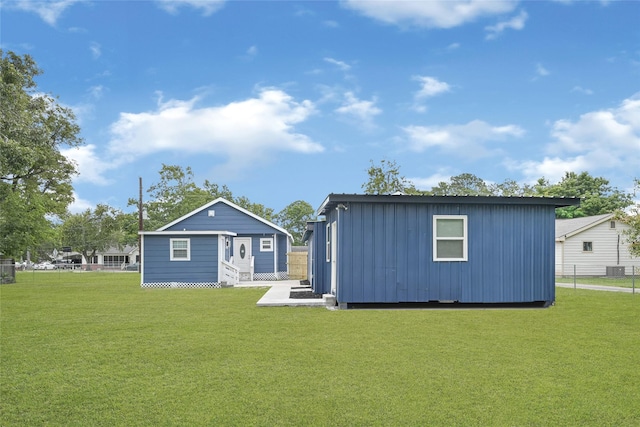 2406 W Elvinta St, Baytown, TX 77520 - back of house with an outbuilding and board and batten siding