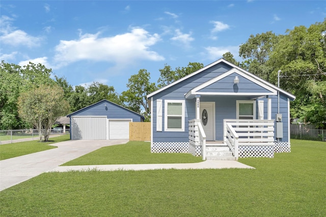 2406 W Elvinta St, Baytown, TX 77520 - view of front facade with a garage, covered porch, and concrete driveway
