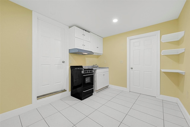 2406 W Elvinta St, Baytown, TX 77520 - kitchen with black gas range, exhaust hood, baseboards, white cabinetry, and a sink