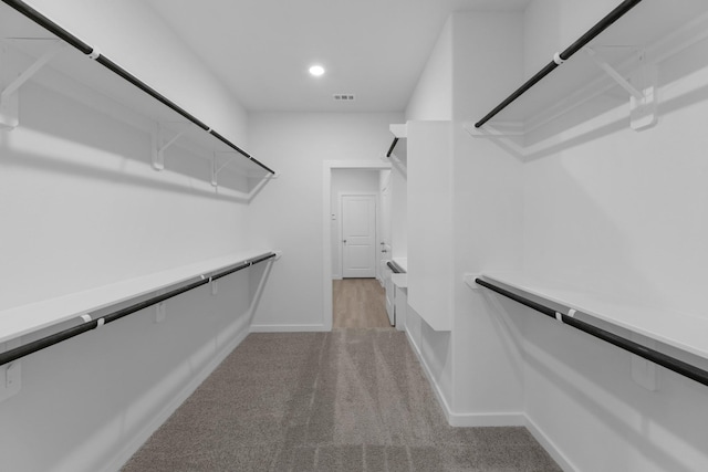 19380 Poppy Village Cir, Magnolia, TX 77355 - walk in closet featuring light colored carpet