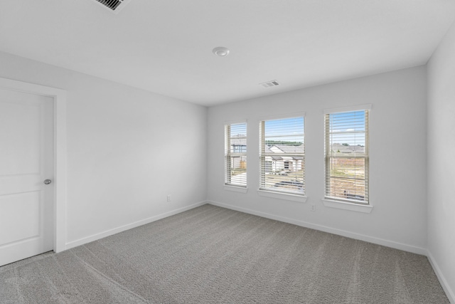 19380 Poppy Village Cir, Magnolia, TX 77355 - carpeted empty room featuring plenty of natural light and baseboards
