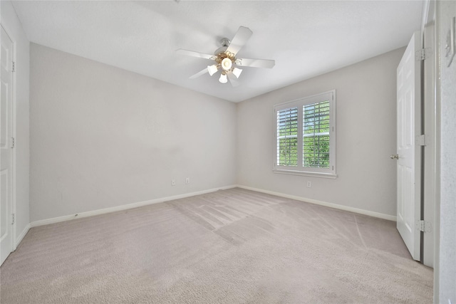 14414 Spanish River Ln, Cypress, TX 77429 - unfurnished bedroom featuring light carpet, baseboards, and a ceiling fan