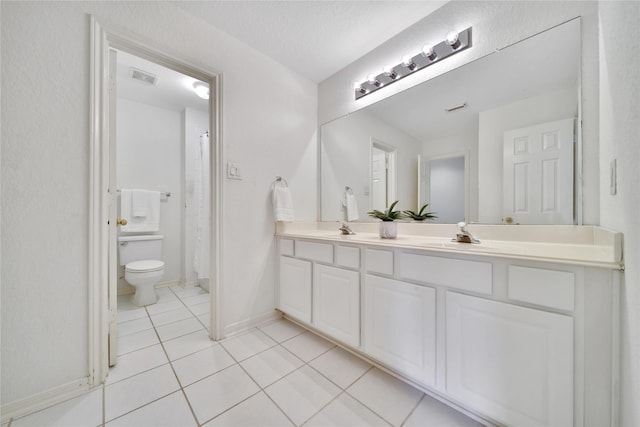 14414 Spanish River Ln, Cypress, TX 77429 - full bath with tile patterned floors, double vanity, toilet, and baseboards