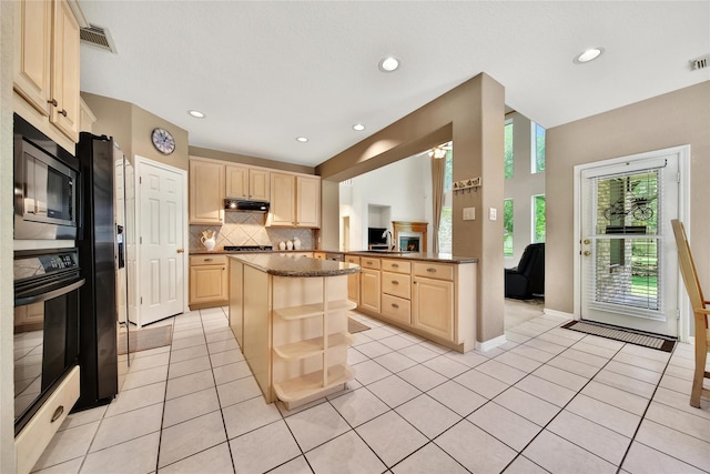 14414 Spanish River Ln, Cypress, TX 77429 - kitchen featuring light brown cabinetry, black appliances, under cabinet range hood, backsplash, and recessed lighting