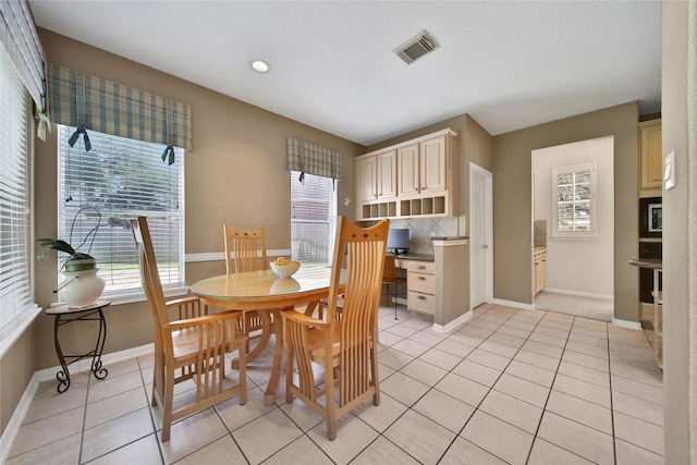 14414 Spanish River Ln, Cypress, TX 77429 - dining room with light tile patterned floors and recessed lighting