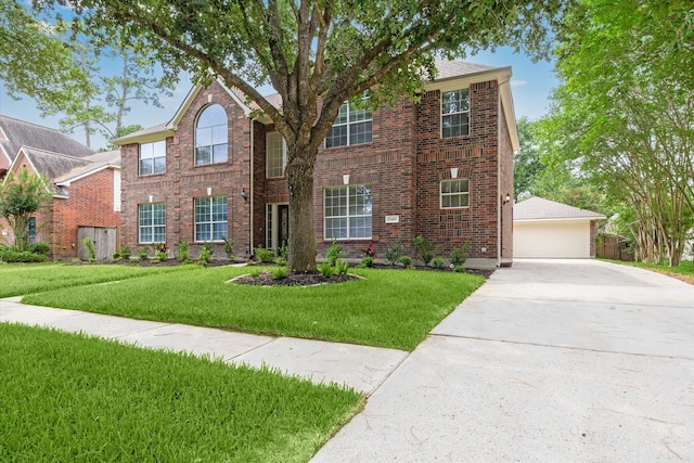 13411 SE Via Chianti Ln, Cypress, TX 77429 - traditional-style house with brick siding, a front lawn, and a garage