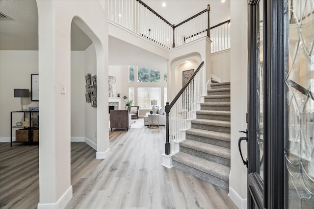 13411 SE Via Chianti Ln, Cypress, TX 77429 - foyer featuring wood finished floors, stairs, and baseboards