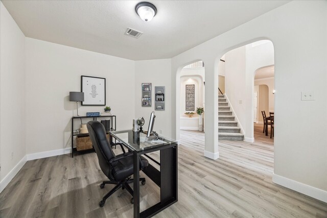 13411 SE Via Chianti Ln, Cypress, TX 77429 - office featuring arched walkways, light wood-style flooring, and baseboards