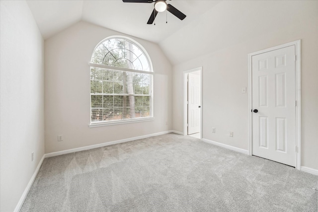 13411 SE Via Chianti Ln, Cypress, TX 77429 - unfurnished bedroom featuring carpet flooring, vaulted ceiling, baseboards, and ceiling fan