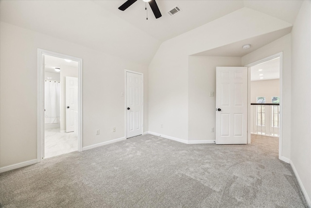 13411 SE Via Chianti Ln, Cypress, TX 77429 - unfurnished bedroom featuring carpet, vaulted ceiling, connected bathroom, and baseboards