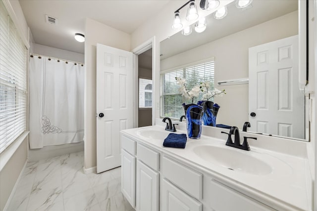 13411 SE Via Chianti Ln, Cypress, TX 77429 - bathroom with double vanity, marble finish floors, and curtained shower