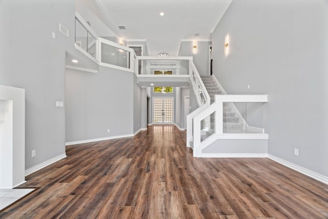 1806 Quiet Country Ct, Houston, TX 77345 - unfurnished living room featuring stairs, wood finished floors, a high ceiling, baseboards, and ornamental molding