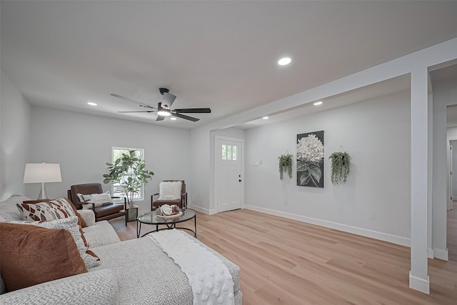 7406 Valeda Dr, Deer Park, TX 77536 - living room with light wood-style flooring, ceiling fan, baseboards, and recessed lighting