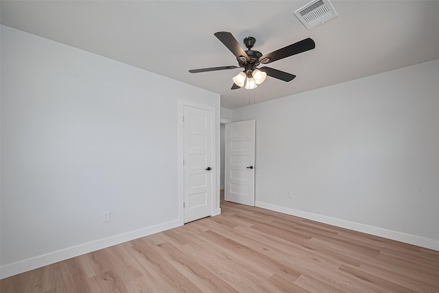 7406 Valeda Dr, Deer Park, TX 77536 - spare room featuring light wood-type flooring, ceiling fan, and baseboards