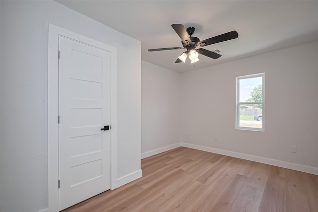 7406 Valeda Dr, Deer Park, TX 77536 - spare room featuring light wood finished floors, ceiling fan, and baseboards