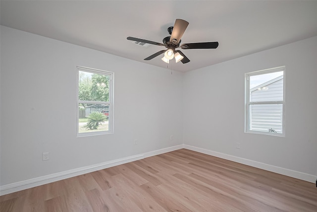7406 Valeda Dr, Deer Park, TX 77536 - unfurnished room featuring light wood-style flooring, baseboards, and ceiling fan
