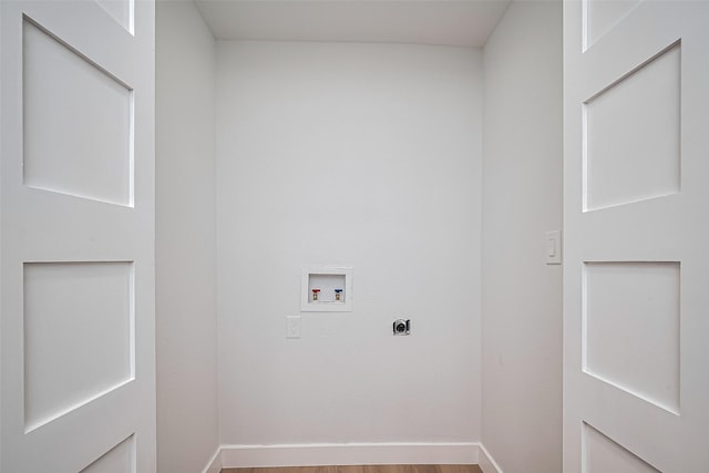 7406 Valeda Dr, Deer Park, TX 77536 - laundry room with electric dryer hookup, hookup for a washing machine, wood finished floors, and baseboards