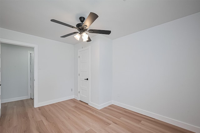 7406 Valeda Dr, Deer Park, TX 77536 - empty room with light wood-type flooring, baseboards, and a ceiling fan