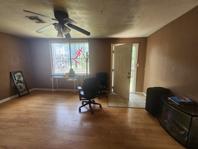 2172 W Laurel, San Antonio, TX 78201 - entryway featuring a textured ceiling, light wood-style floors, ceiling fan, and baseboards