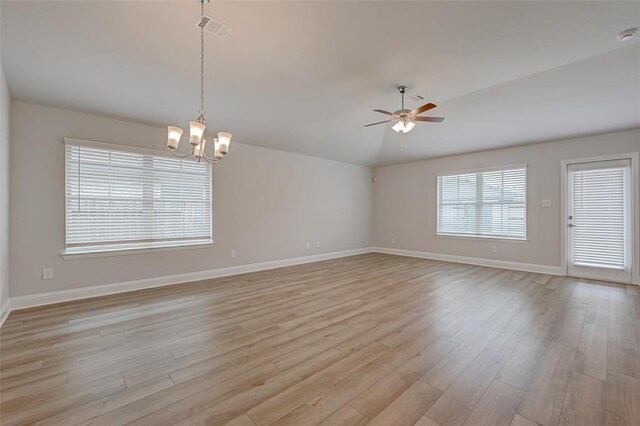 2214 Salton Sea Ln, Texas City, TX 77568 - unfurnished room with a chandelier, baseboards, a ceiling fan, and light wood-style floors