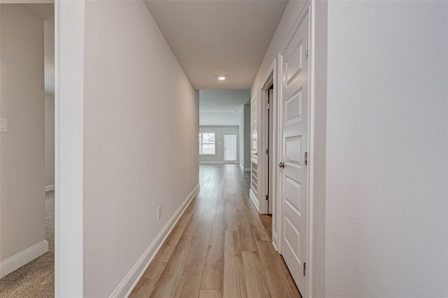 2214 Salton Sea Ln, Texas City, TX 77568 - corridor featuring baseboards, light wood-style floors, and recessed lighting