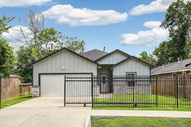 4633 Larkspur St, Houston, TX 77051 - view of front of home with a shingled roof, board and batten siding, a garage, and concrete driveway