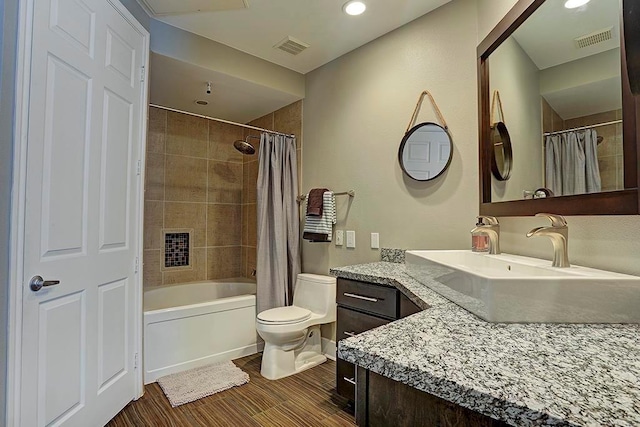 2400 Mccue Rd Unit 250, Houston, TX 77056 - full bathroom featuring vanity, toilet, shower / tub combo with curtain, wood finished floors, and recessed lighting