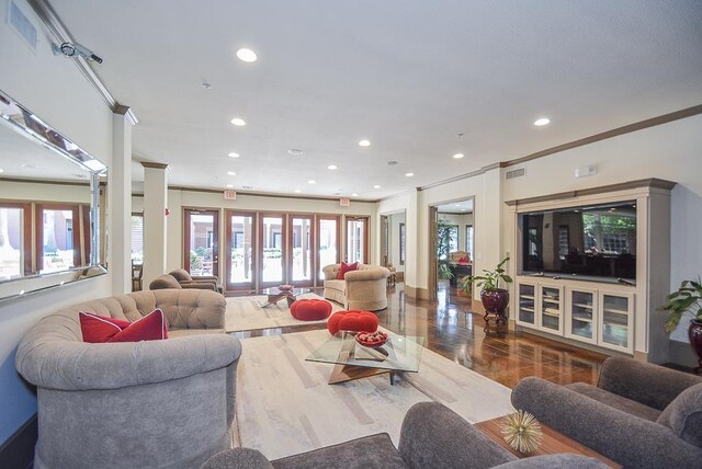 2400 Mccue Rd Unit 250, Houston, TX 77056 - living area featuring crown molding, recessed lighting, and wood finished floors
