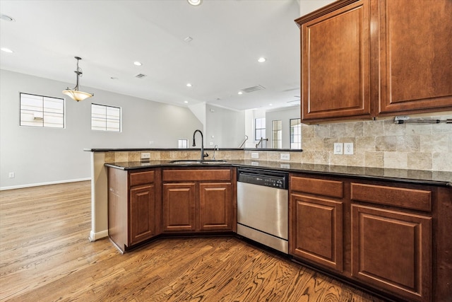 5308 Larkin St Unit B, Houston, TX 77007 - kitchen with a sink, dishwasher, wood finished floors, baseboards, and backsplash