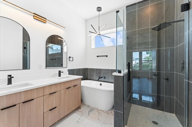 3209 Baer St Unit B, Houston, TX 77020 - full bath with a stall shower, a freestanding bath, double vanity, and marble look tiles
