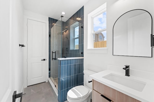 3209 Baer St Unit B, Houston, TX 77020 - bathroom featuring vanity, a stall shower, marble look tile flooring, and recessed lighting