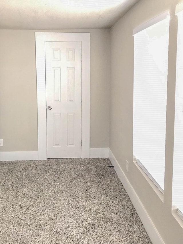 214 W Republic St Unit 10, Baytown, TX 77520 - carpeted empty room with baseboards