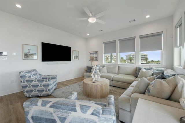 3903 Evening Primrose Dr, Galveston, TX 77554 - living room with wood finished floors, recessed lighting, ceiling fan, and baseboards