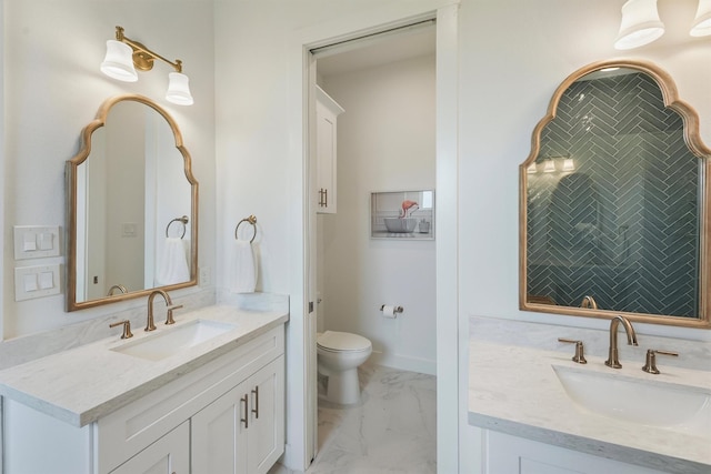 3903 Evening Primrose Dr, Galveston, TX 77554 - bathroom featuring marble look tiles, vanity, and toilet