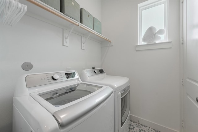 3903 Evening Primrose Dr, Galveston, TX 77554 - laundry room with washing machine and dryer and baseboards