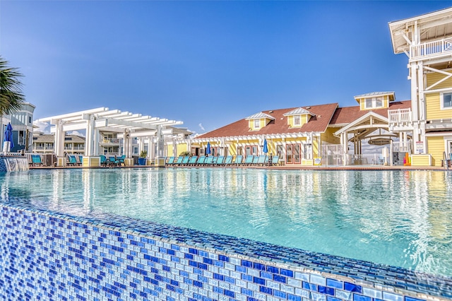3903 Evening Primrose Dr, Galveston, TX 77554 - community pool featuring a pergola