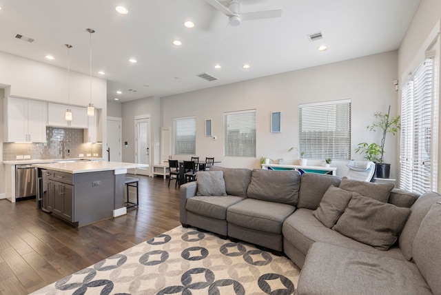 1703 Freeman St, Houston, TX 77009 - living area featuring dark wood-type flooring, a ceiling fan, and recessed lighting